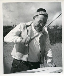 Photograph of Bill Walker hammering a nail