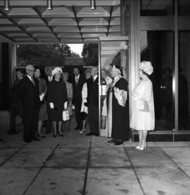 Photograph of the Queen Mother and Henry Hicks arriving at an event