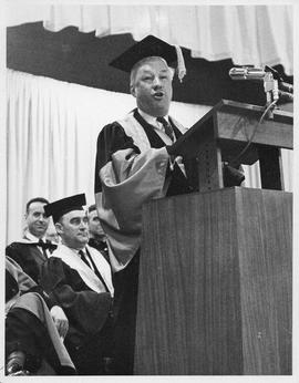 Photograph of Henry Hicks speaking at a podium