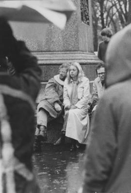 Photograph of Hilary Kitz and John Kitz sitting at the base of the Robert Burns statue in Victori...