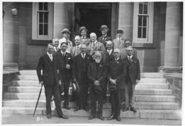 Photograph of a group of people on the front steps of the MacDonald Library
