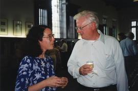 Photograph of Susan Harris and an unidentified man at Patricia Lutley's retirement party