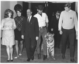 Photograph of attendees with a tiger at the opening of the Student Union Building