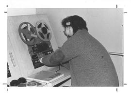 Photograph of Gerard Dolan transferring a lecture from video to audio tape