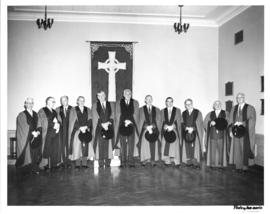 Photograph of several men in academic dress at the opening ceremony of the Sir James Dunn Building