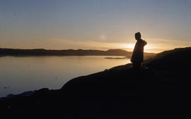 Photograph of a woman looking out over Frobisher Bay, Northwest Territories