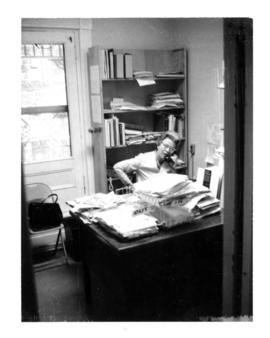 Photograph of the Librarian in office of the Medical-Dental Library at 5963 College Street