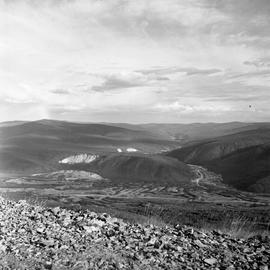 Photograph taken from a hill overlooking a valley in the Yukon