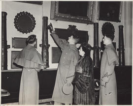Photograph of Ellen Ballon touring the West Point museum with cadets
