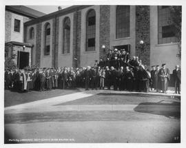 Photograph of a group of people standing outside of the Studley gym