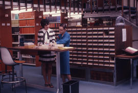 Photograph of the W.K. Kellogg Health Science Library staff and library catalogue