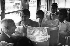 Photograph of unidentified people on a bus