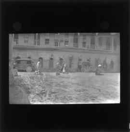Photograph of unidentified soldiers and people next to a YMCA building