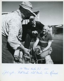 Photograph of Will and Neil Mosher and Thomas Head Raddall at Moose Harbour, Nova Scotia