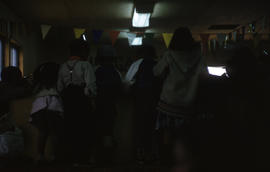 Photograph of several children in a hall
