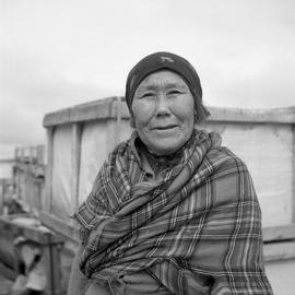 Portrait of Minnie Manna wearing a tartan shawl in Fort Chimo, Quebec