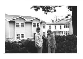 Photograph of two students standing in front of Eliza Ritchie Hall