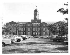 Photograph of the Arts and Administration building and campus parking lot