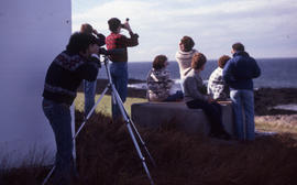 Photograph of Bill Freedman using binoculars on Brier Island, Nova Scotia