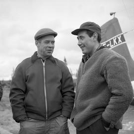 Photograph of Jacques Dumas and George Koneak talking together in Fort Chimo, Quebec