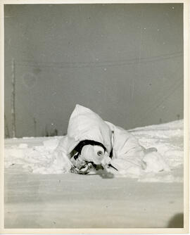 Photograph of Corporal G.F. Morton engaging in winter infantry training at Debert