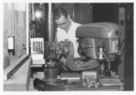 Photograph of skilled technicians in the Psychology Workshop building equipment used in teaching ...