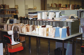 Photograph of books damaged in the 1998 Killam Library fire drying on a table