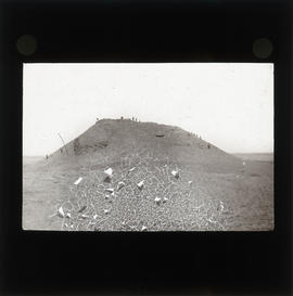 Photograph of a group of people on a hill
