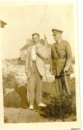 Photograph of T.H. Raddall, Sr. in uniform while on leave in England with a gentleman in plainclo...