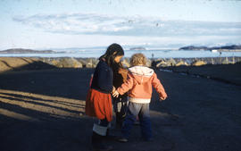 Photograph of three children playing in in Frobisher Bay, Northwest Territories
