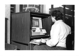 Photograph of a woman using a computer in the Killam Memorial Library