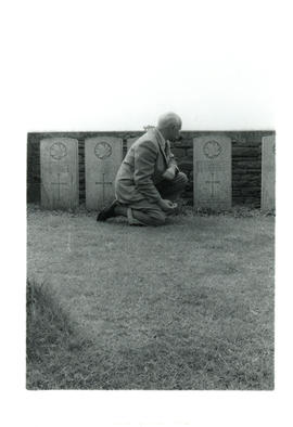 Photograph of Thomas Head Raddall at his father's grave in the Manitoba Cemetery, Amiens Battlefi...