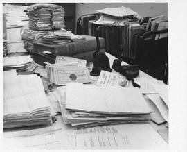 Photograph of piles of documents in the Dalhousie University Archives