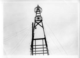 Photograph of the top of a triangle microwave tower