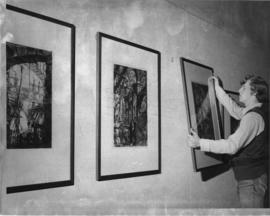 Photograph of Stephen Gertridge hanging art