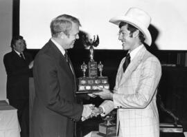 Photograph of Pierre Page and Guy R. MacLean : Coach of the Year award presentation