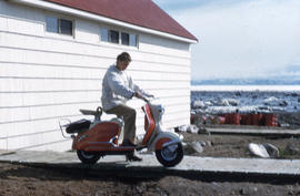 Photograph of Barbara Hinds on a scooter in Frobisher Bay, Northwest Territories