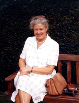 Photograph of Barbara Hinds sitting on a bench