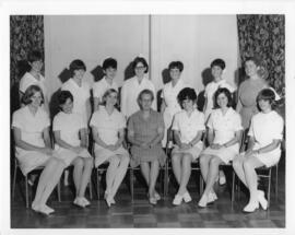 Photograph and photopgraphic negative of the first graduates of the Bachelor of Nursing Program