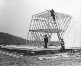 Photograph of the construction of an A-frame building for research and dwelling on Sable Island