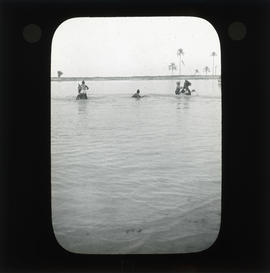 Photograph of unidentified soldiers on horseback in water