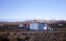 Photograph of two small buildings on the tundra in northern Quebec