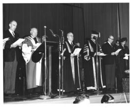Photograph of A. E. Kerr, Lady Dunn, and others on stage
