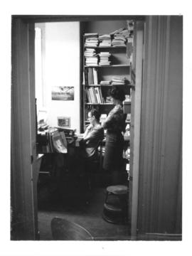 Photograph of Ruth Cordy and Anita Watson in the Cataloging Office of the 5963 College Street bui...