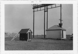 Photograph of a tower and a hut at Egmont Bay, Prince Edward Island