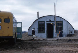 Photograph of a bus and a small building in Frobisher Bay, Northwest Territories