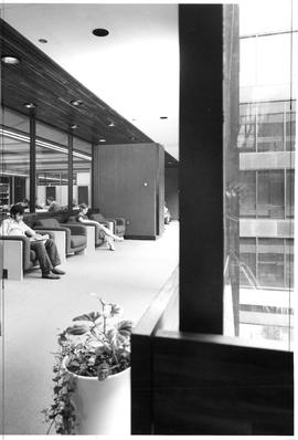 Photograph of a hallway with arm chairs in the Killam Memorial Library