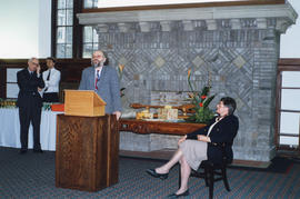 Photograph of a guest speaking at Sylvia Fullerton's retirement party