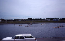 Photograph of a boat race with eight teams visible