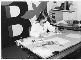 Photograph of Bev Cunningham preparing charts